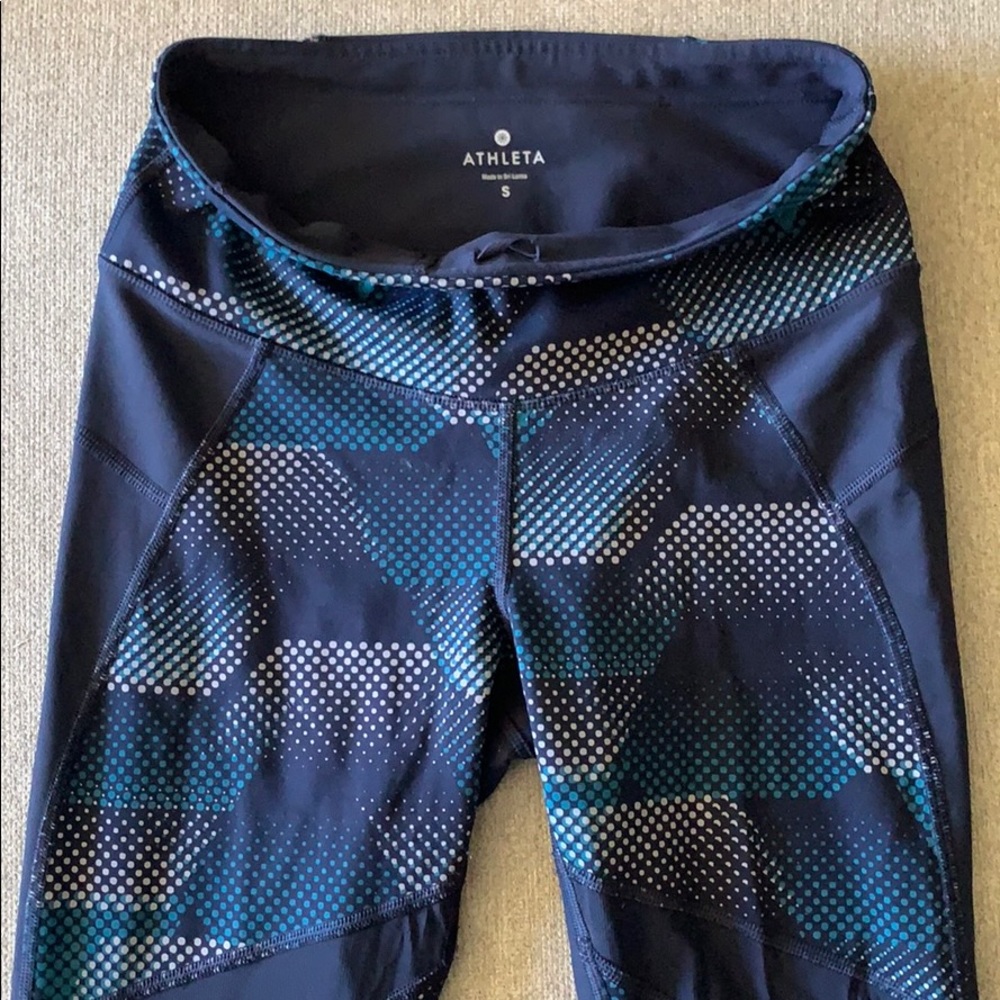 Athleta navy leggings with mesh detailing.